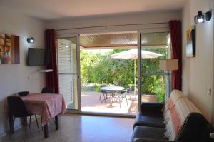 a living room with a couch and a table at Tavira Vacations Apartments in Tavira