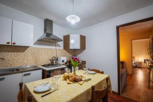a kitchen with a table with a bowl of food on it at Teatro in Anghiari +31 photos