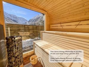 a sauna with a view of the mountains at Alpine Apartments St-Sigmund in Sankt Sigmund im Sellrain
