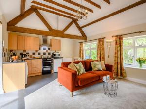 a living room with a couch and a kitchen at 1 Bed in Dorchester oc-dc026 in Broadmayne