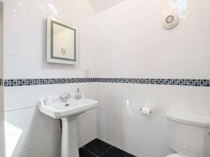 a white bathroom with a sink and a toilet at 1 Bed in Dorchester oc-dc026 in Broadmayne +14 photos