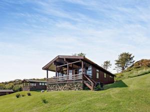 a house on top of a grassy hill at 2 Bed in Aberdyfi oc-dy050 in Aberdyfi