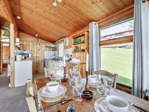 a dining room and kitchen in a tiny house at 2 Bed in Aberdyfi oc-dy050 in Aberdyfi +10 photos
