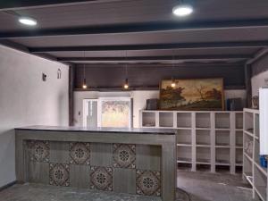 a kitchen with a counter top in a room at El Rincón del Olivo in Cartagena