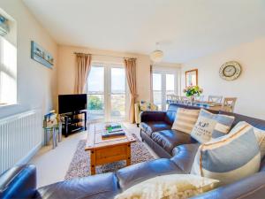 a living room with a couch and a table at 3 Bed in Shanklin oc-ic113 in Shanklin