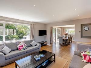 a living room with a couch and a table at 4 Bed in Braunton oc-56111 in Croyde