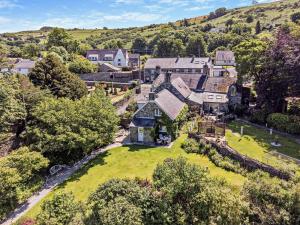 an aerial view of a large house with a yard at 2 Bed in Caernarfon oc-56989 in Clynnog-fawr