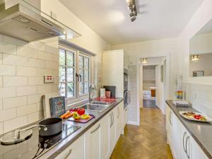 a kitchen with a sink and a counter top at 2 Bed in Caernarfon oc-56989 in Clynnog-fawr +20 photos