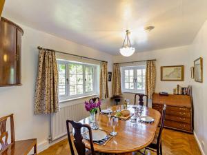 a dining room with a wooden table and chairs at 2 Bed in Caernarfon oc-56989 in Clynnog-fawr
