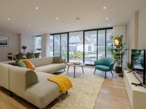 a living room with a couch and a tv at 2 Bed in Porthcawl oc-89696 in Porthcawl