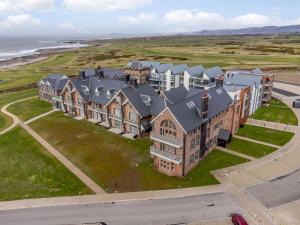 an aerial view of a large house on the beach at 2 Bed in Porthcawl oc-89696 in Porthcawl