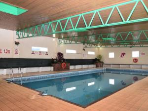 a large swimming pool in a building at 2 Bed in Brixham oc-90912 in Brixham