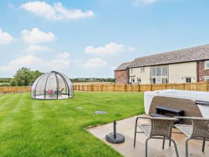 a backyard with a dome tent in the grass at 2 Bed in Wakefield oc-93235 in Crofton