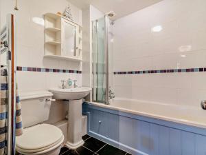 a bathroom with a toilet and a sink and a tub at 2 Bed in Bridport oc-94222 in Bridport +17 photos