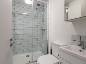 a bathroom with a shower and a toilet and a sink at 3 Bed in Brixham oc-88116 in Brixham +16 photos
