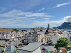 an aerial view of a town with buildings and the ocean at 5 Bed in Ilfracombe oc-89563 in Ilfracombe