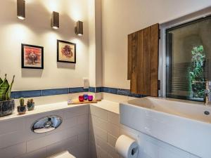 a bathroom with a sink and a mirror at 2 Bed in Arthog oc-66611 in Arthog +16 photos