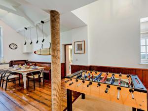 a dining room with a large pool table at 3 Bed in Barnstaple oc-53109 in Braunton