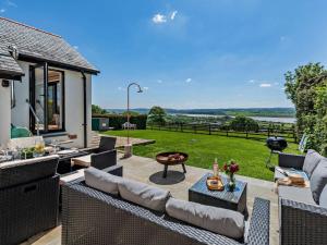 a patio with furniture and a view of a yard at 3 Bed in Barnstaple oc-53109 in Braunton