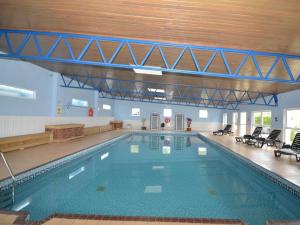 a large swimming pool in a large building at 2 Bed in Brixham oc-bx079 in Brixham