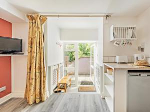 a kitchen with a door leading to a patio at 1 Bed in Llangollen oc-92336 in Llangollen