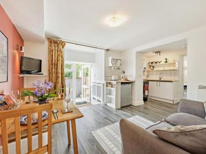 a living room with a couch and a table at 1 Bed in Llangollen oc-92336 in Llangollen +8 photos