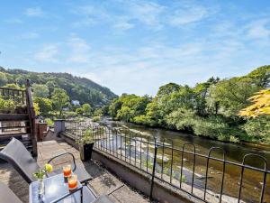 a view of a river from a balcony at 1 Bed in Llangollen oc-92336 in Llangollen