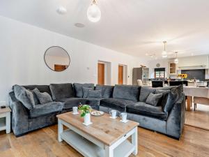a living room with a couch and a table at 4 Bed in Ilfracombe oc-95899 in Berrynarbor
