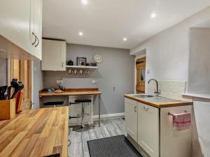 a kitchen with a sink and a counter top at 2 Bed in South Molton oc-55221 in Bishops Nympton +11 photos