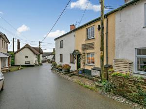an empty street in a small town with houses at 2 Bed in South Molton oc-55221 in Bishops Nympton
