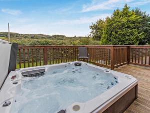 a hot tub on the deck of a house at 2 Bed in Okehampton oc-74242 in Okehampton