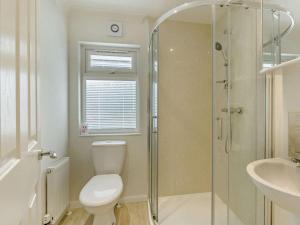 a bathroom with a shower and a toilet and a sink at 2 Bed in Okehampton oc-85432 in Okehampton +8 photos