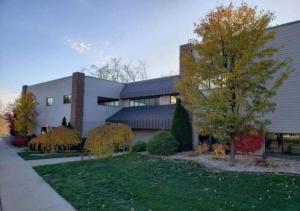 a building with a tree in front of it at Rivers Edge Lofts - Unit 2 in Niles