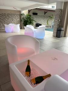 a bottle of champagne sitting in a white box at Relax Appart Hôtel in Kourou