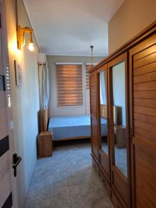 a small bedroom with a bed and a window at Salmaan Villa in Grand-Baie +25 photos