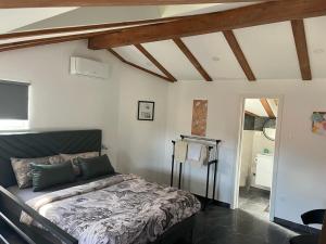a bedroom with a bed in a room at Amorino Apartman Studio in Opatija