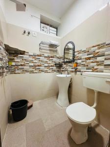 a bathroom with a toilet and a sink at Hotel Panna Haveli in Jaipur +28 photos
