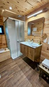 a bathroom with a shower and a large sink at Le Moulin de Trévelo in Caden +51 photos