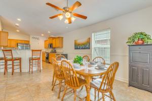 a kitchen and dining room with a table and chairs at Private Pool + Patio: Pensacola Family Home! in Perdido Key