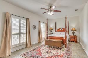 a bedroom with a bed and a ceiling fan at Private Pool + Patio: Pensacola Family Home! in Perdido Key +29 photos