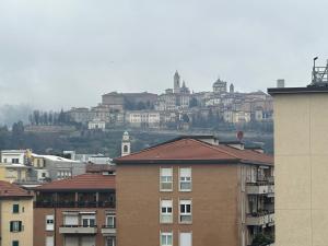 a view of a city with buildings in the background at FEEL - Bellavista Suites in Bergamo