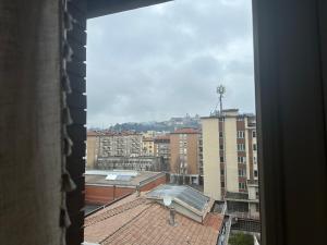 a view of a city from a window at FEEL - Bellavista Suites in Bergamo +37 photos
