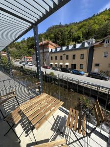 a wooden bench sitting on top of a balcony at Varandas do Gerês in Geres