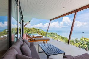 a living room with a view of the ocean at Shamgrila - Panoramic Sea View in Ko Phangan