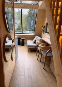 a room with a couch and a table in a house at Yatak in Vatra Dornei +37 photos