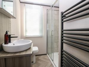 a bathroom with a sink and a shower at Plot 243 - Coldingham Bay Leisure Park in Eyemouth +13 photos