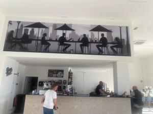 a group of people sitting at a table with umbrellas at Vista Verde in Murcia +39 photos