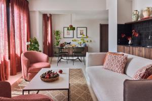 a living room with a couch and a table at Seda Residences in Granada