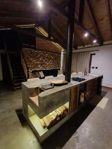 a kitchen with a stove top oven in a room at Cabana Morro das Pedras in Armazém +28 photos