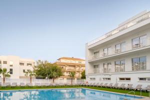 a swimming pool in front of a building at SH Jávea in Jávea +52 photos